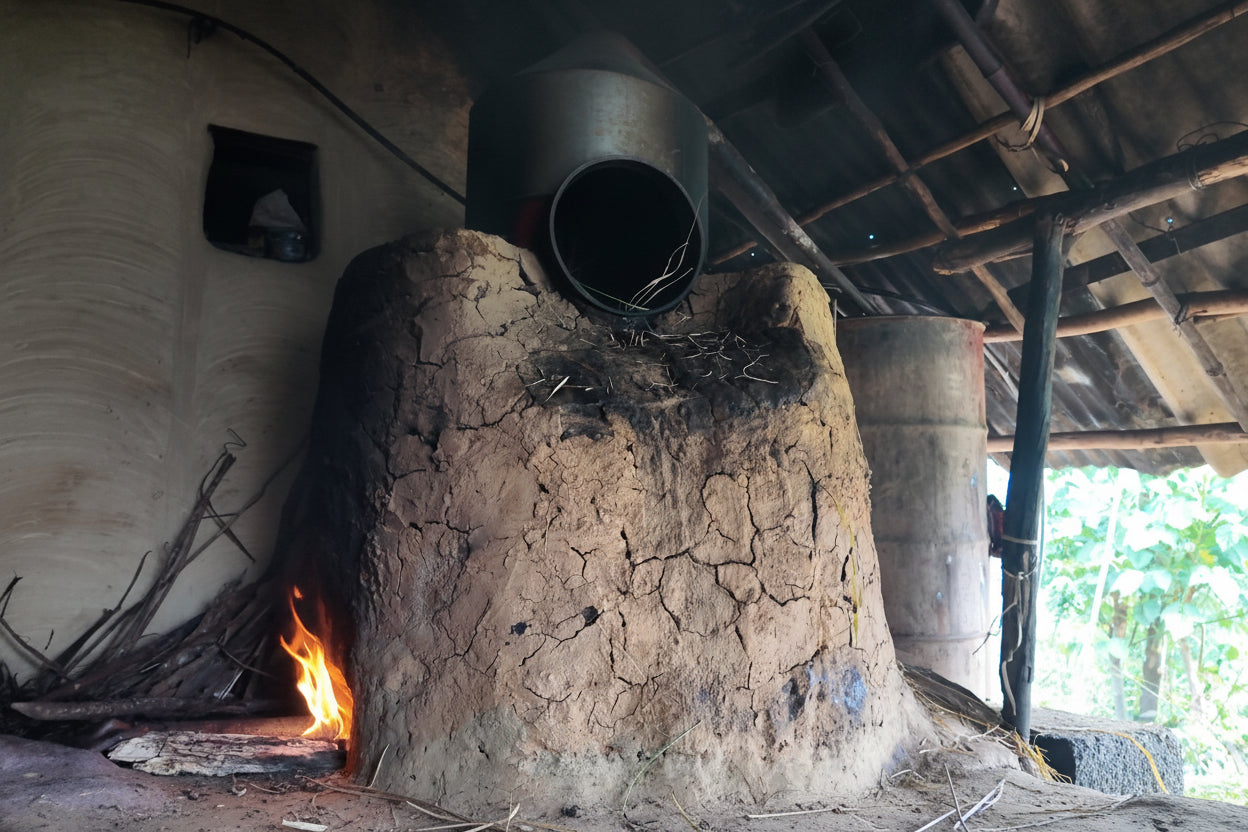 Traditional clay oven with a chimney in a rustic setting