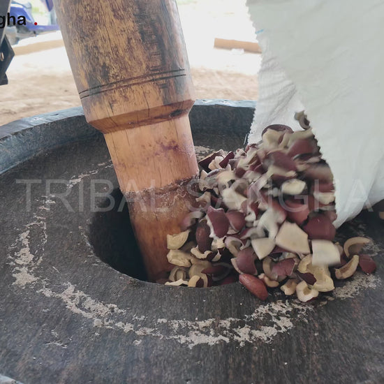 Video showing traditional bull-driven process for extracting stone-pressed coconut baby oil