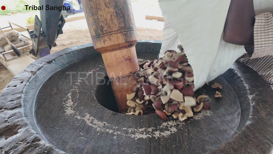 Video showing traditional bull-driven process for extracting stone-pressed coconut baby oil